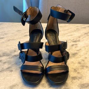 Rachel Zoe Black Learher Adjustable Buckled strappy heel with back zip. Size 7.5